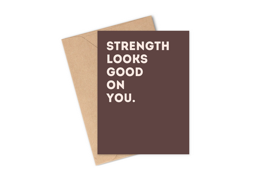 Greeting Card phrase: "Strength Looks Good On You" in dark brown and pink designed by Hey Rosie Creations