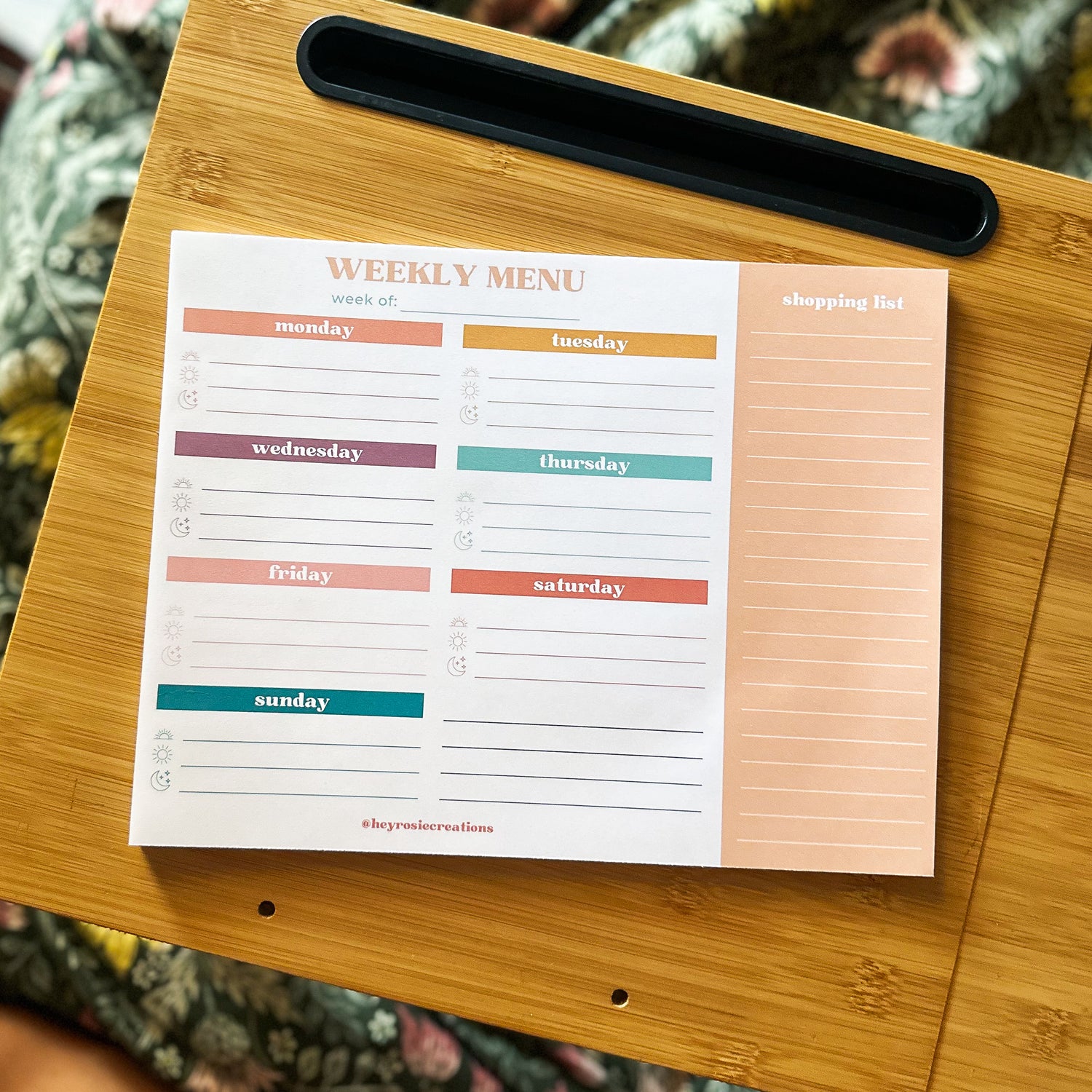 Weekly meal planner with sections for days of the week and space for meal ideas and grocery lists. Designed by Hey Rosie Creations